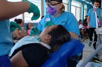 Team members treating dental patient