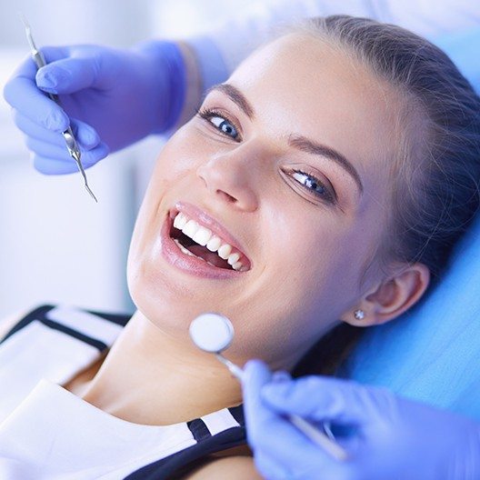 Woman smiling during dental checkup