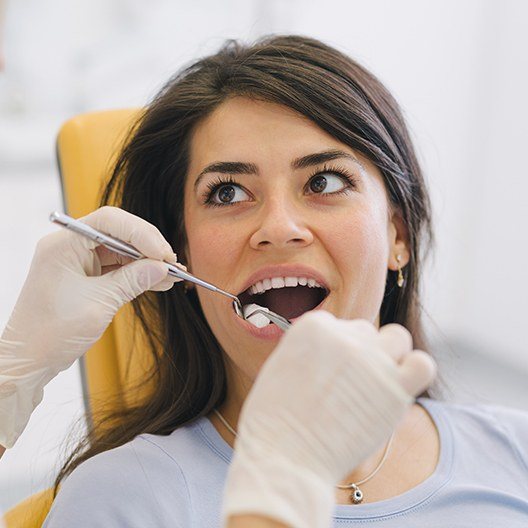Woman receiving root canal therapy