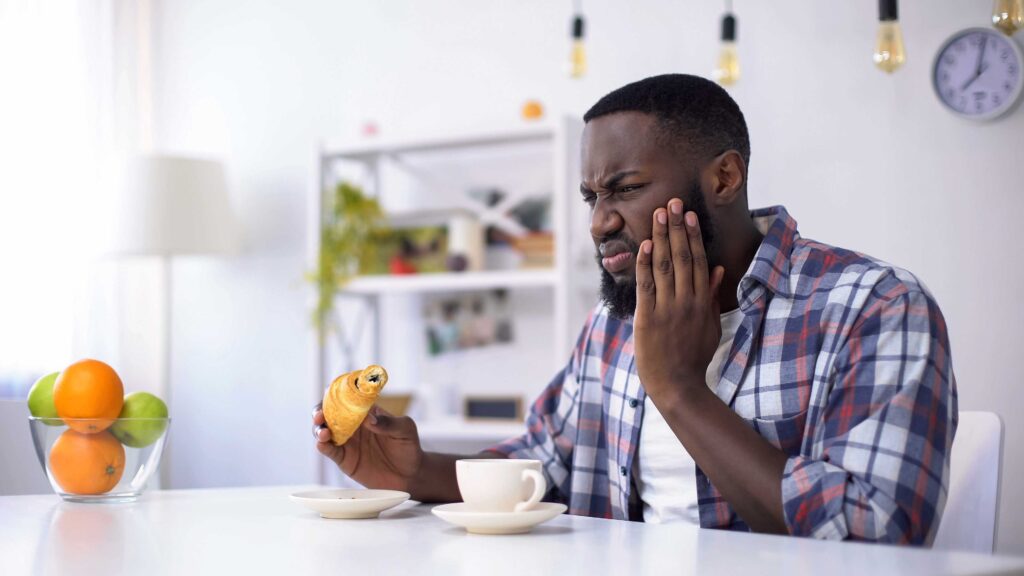 Man with tooth sensitivity