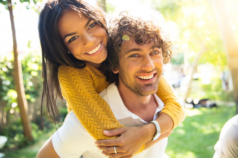 A smiling couple enjoying the outdoors